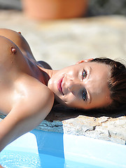 Portugalian girl Tori posing near pool